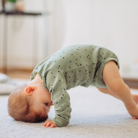 How does a play mat help in the development of a toddler?