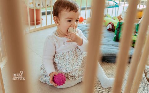 A Child Playing in a Playpen
